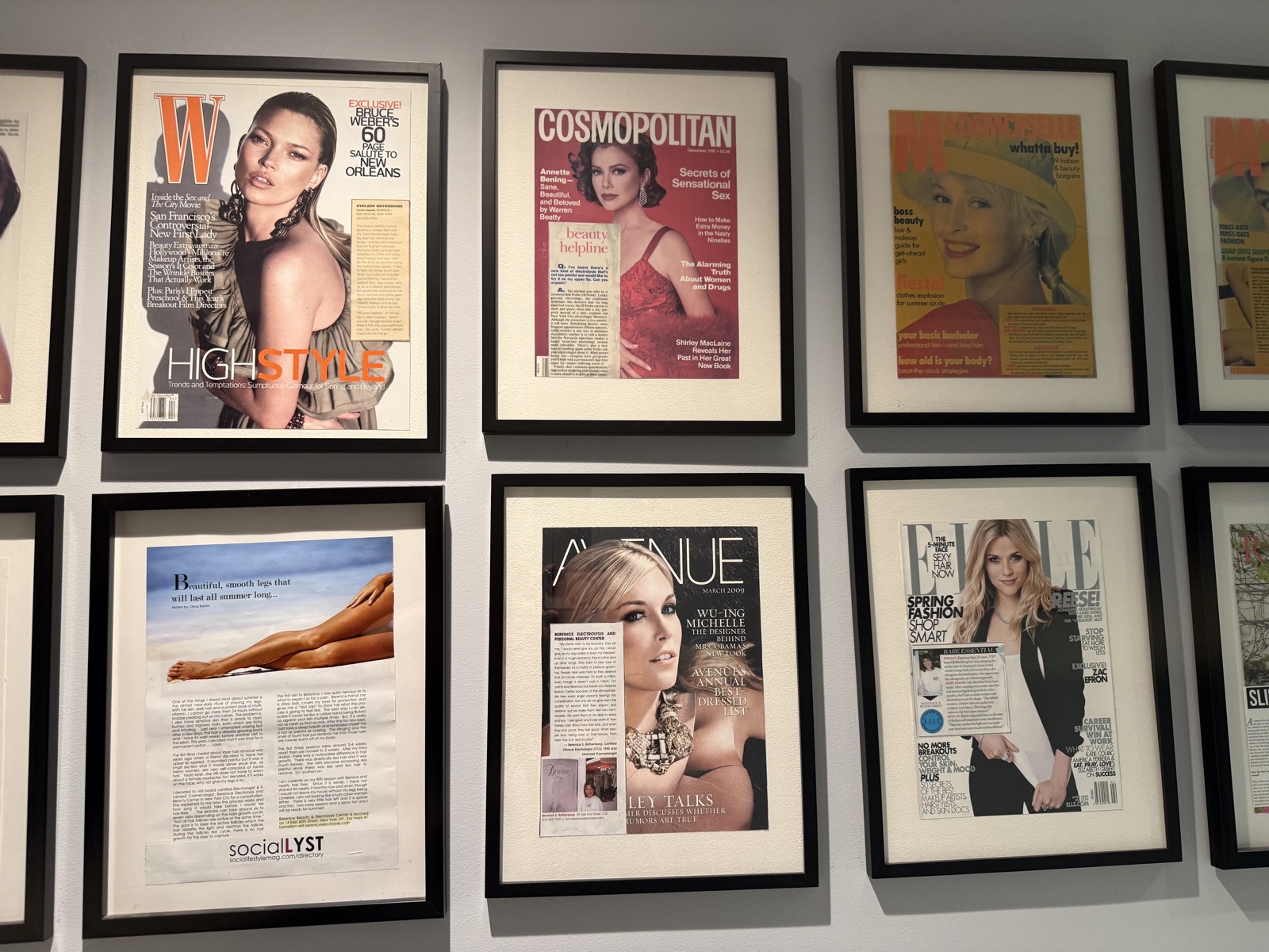 Framed covers of W, Cosmopolitan, Avenue and ELLE on the Berenice press wall